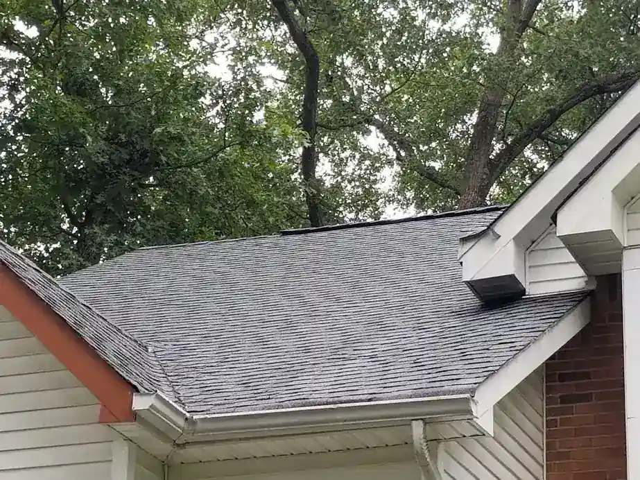 The same shingle roof after a low-pressure roof wash, moss gone